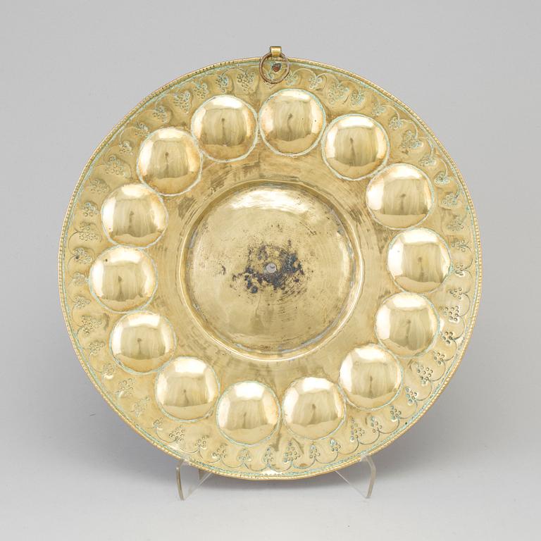 A probably 17th century brass wall plaque.