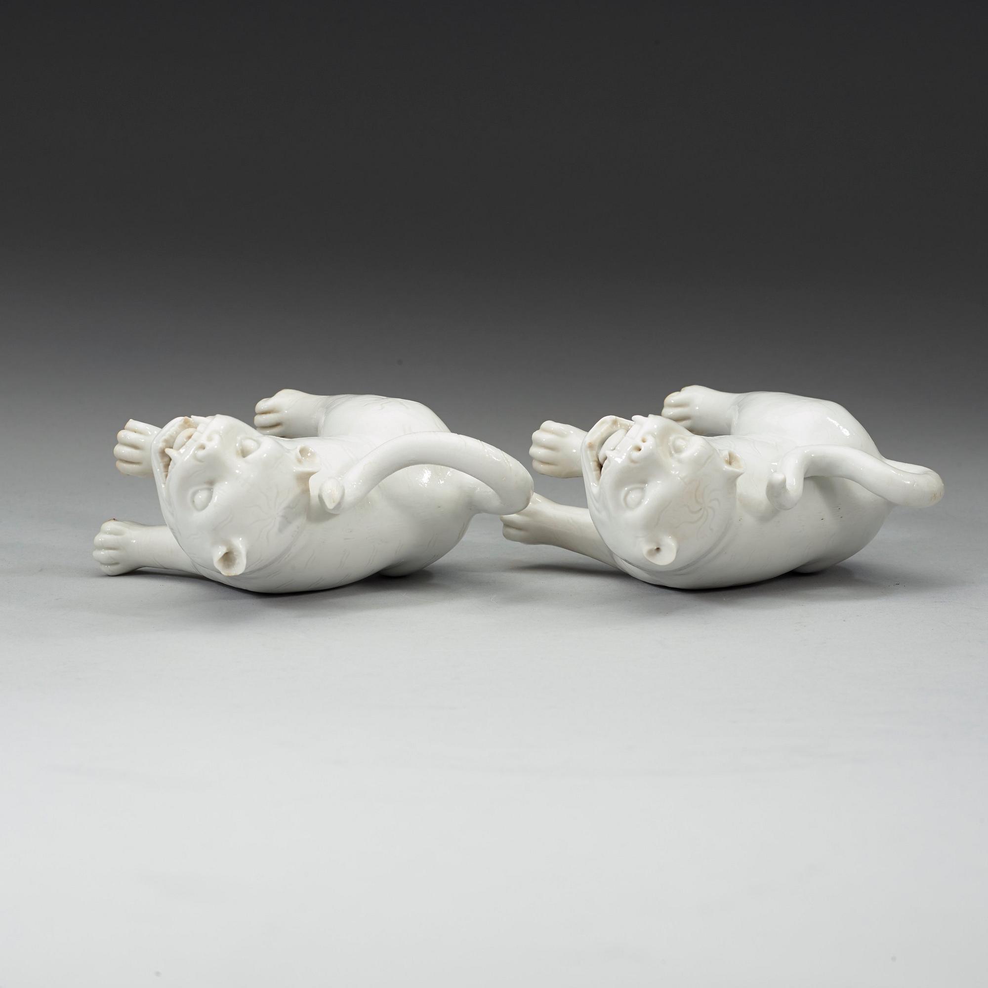 A set of two blanc de chine mythological animals, late Qing dynasty.