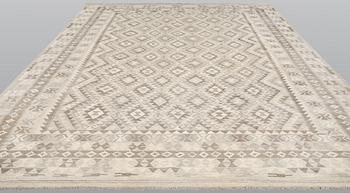 A Kilim carpet, c. 394 x 304 cm.