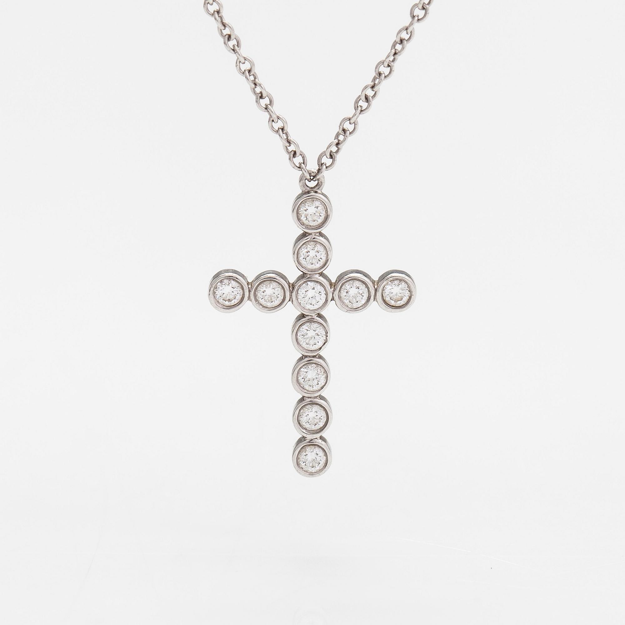 Tiffany & Co, a platinum necklace, 'Jazz Cross' with diamonds approx 0.20ct in total.