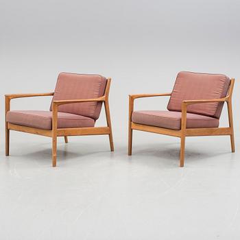 A pair of Folke Ohlsson "USA-75" armchairs for Dux, 1960s.