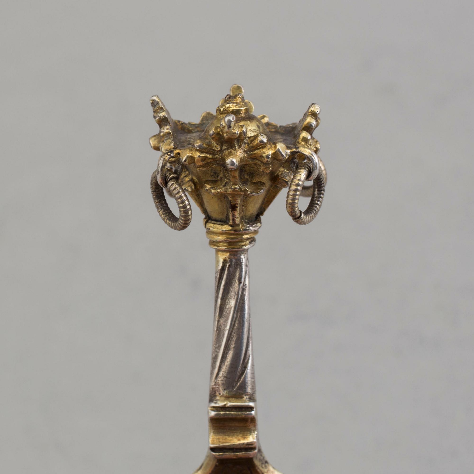A Nordic parcel-gilt silver spoon dated 1586.