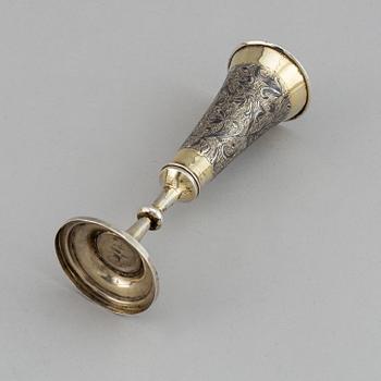 A Russian silver gilt and niello champagne flute, unidentified makers mark, Moscow 1843.