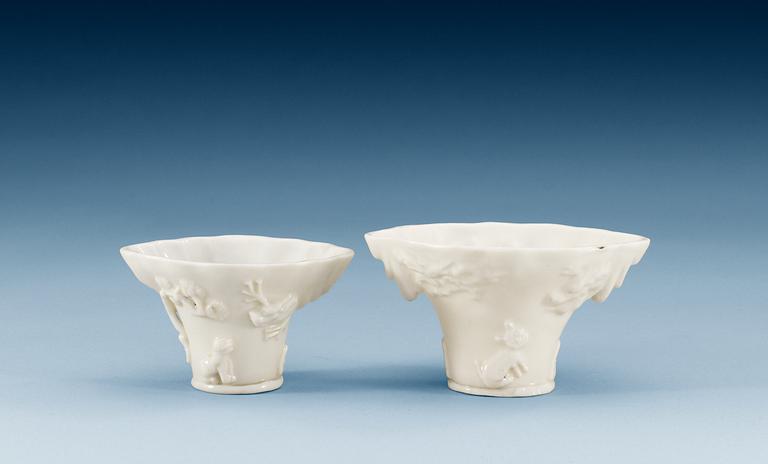Two blanc de chine rhinoserous shaped libation cups, Qing dynasty, Kangxi (1662-1722).
