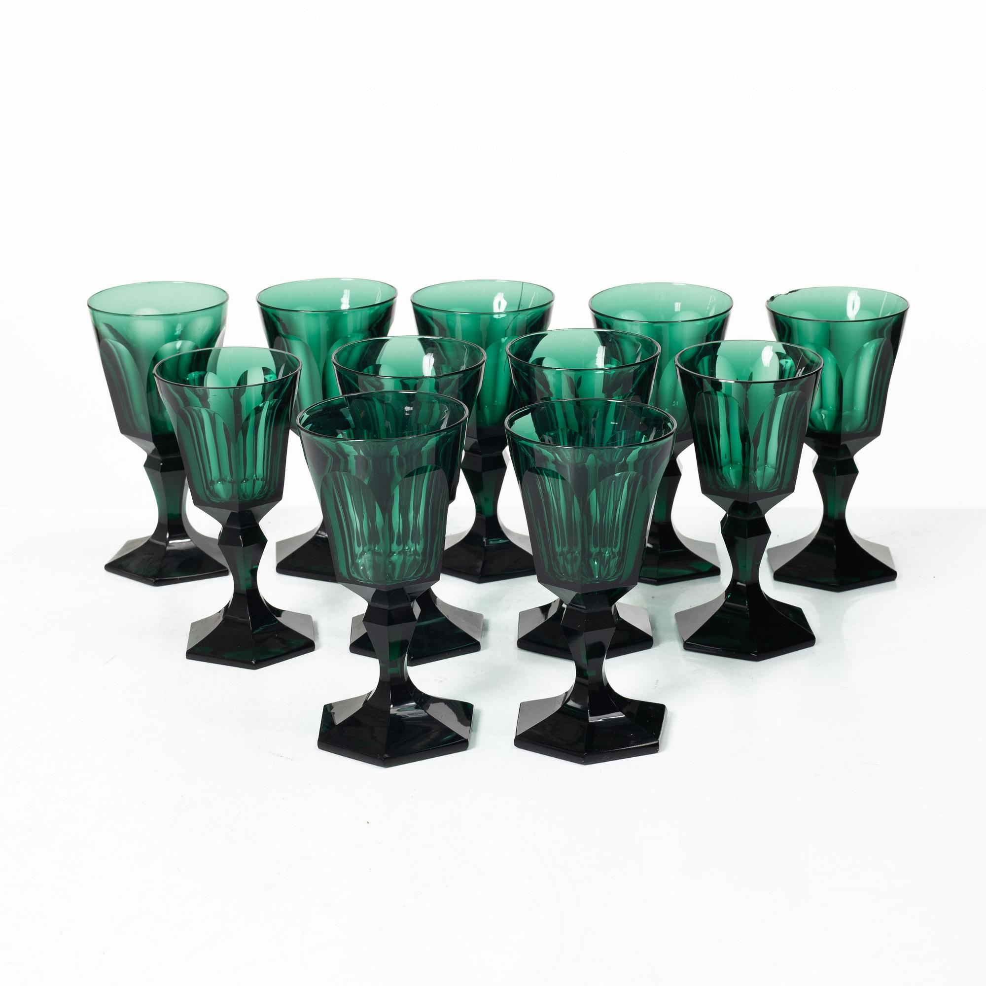 Eleven white wine glasses, green, 19th century.