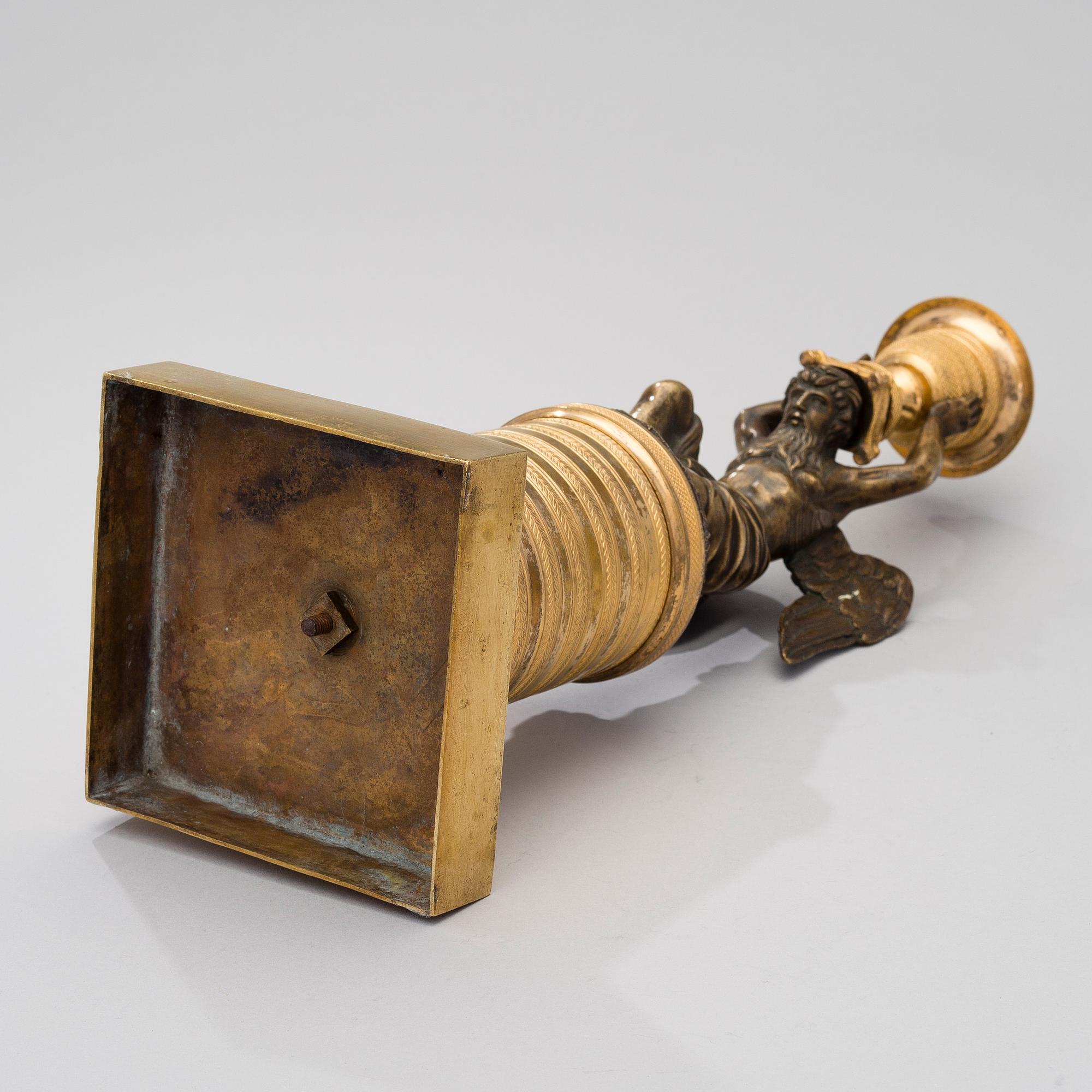 A ORMOLU CANDLESTICK, bronze and gilded bronze, empire early 19th century.