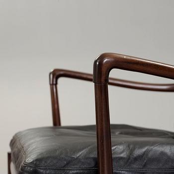 Ole Wanscher, a stained mahogany and black leather 'Colonial Chair PJ 149' and ottoman, Poul Jeppesen, Denmark.