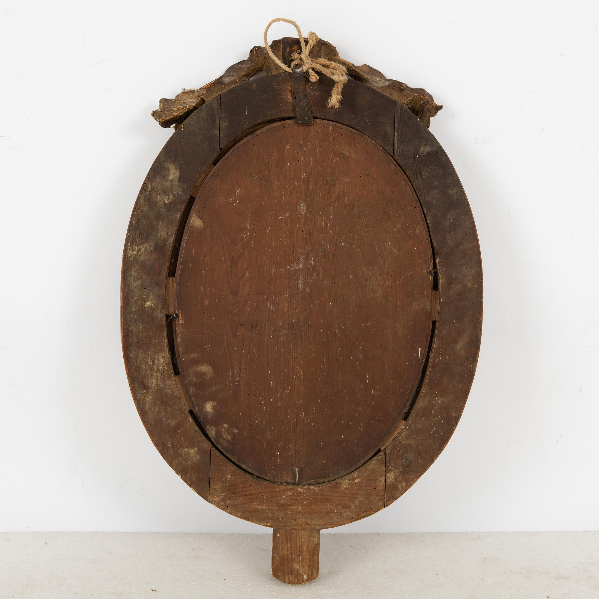 A Gustavian giltwood two-branch girandole mirror, late 18th century.