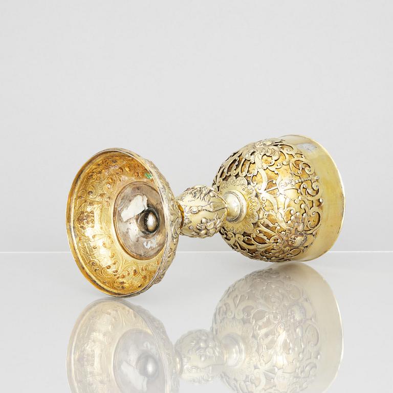 A 17th century silver-gilt cup, marked GM.