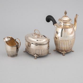 A swedish silver coffee pot, creamer and sugar box, J.E. Torsk, Stockholm 1900.