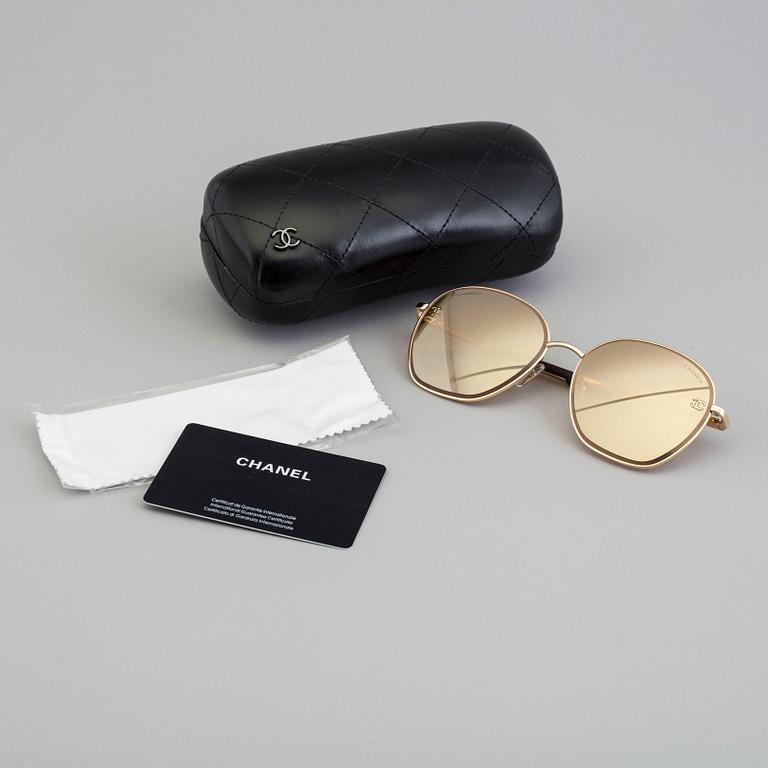 Sunglasses by Chanel.