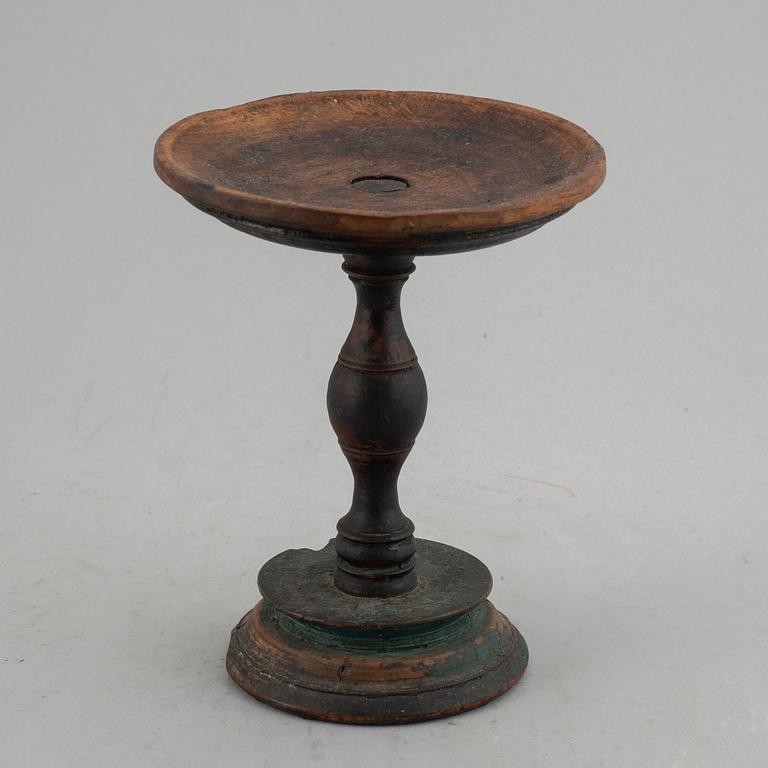 A 19th century wooden butter stand.