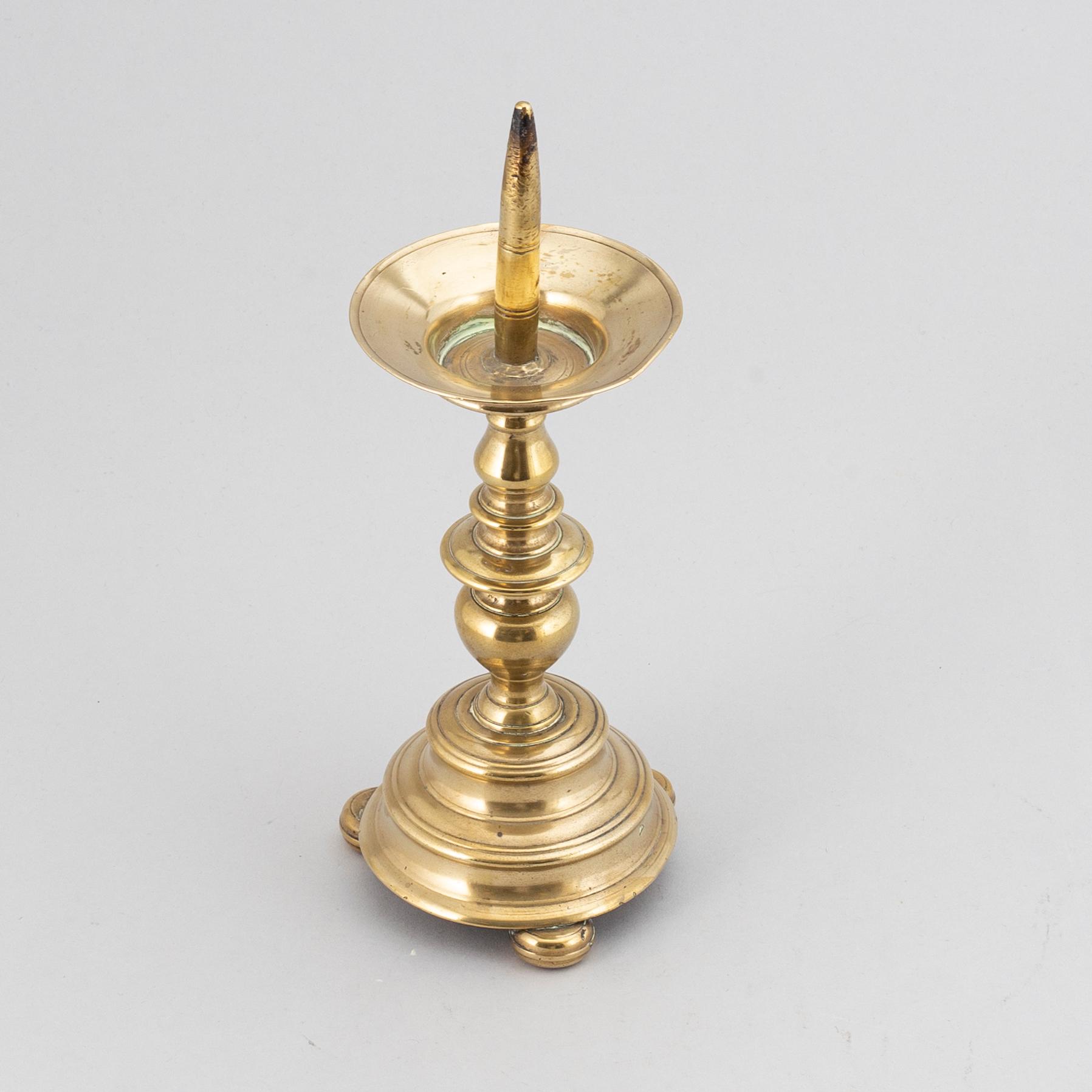 A 16th century bronze candlestick.