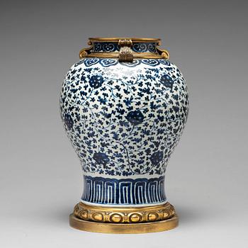 928. A blue and white bronze mounted vase, Qing dynasty, 18th Century.