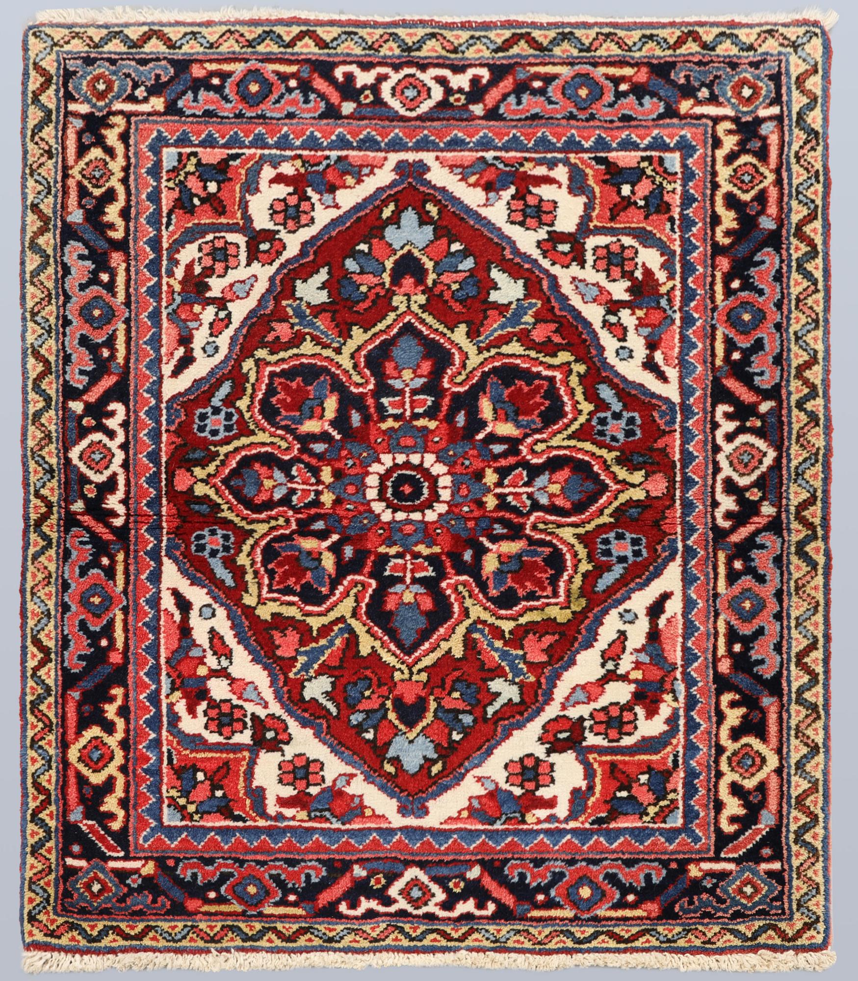 A semi-antique Heris rug, approx. 90 x 78 cm.