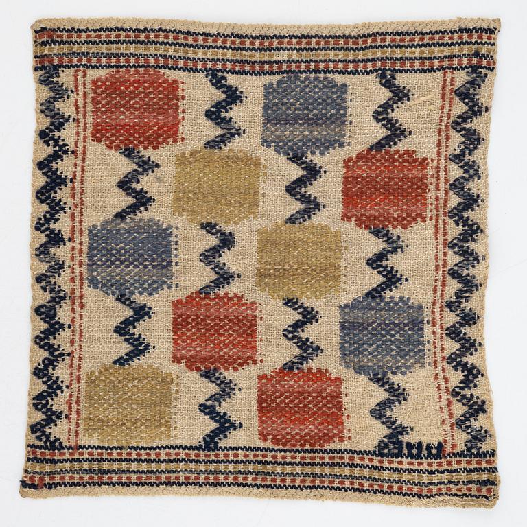 Märta Måås-Fjetterström, a textile, "Skaftblomman", flat weave, c 38 x 37 cm, signed MMF.