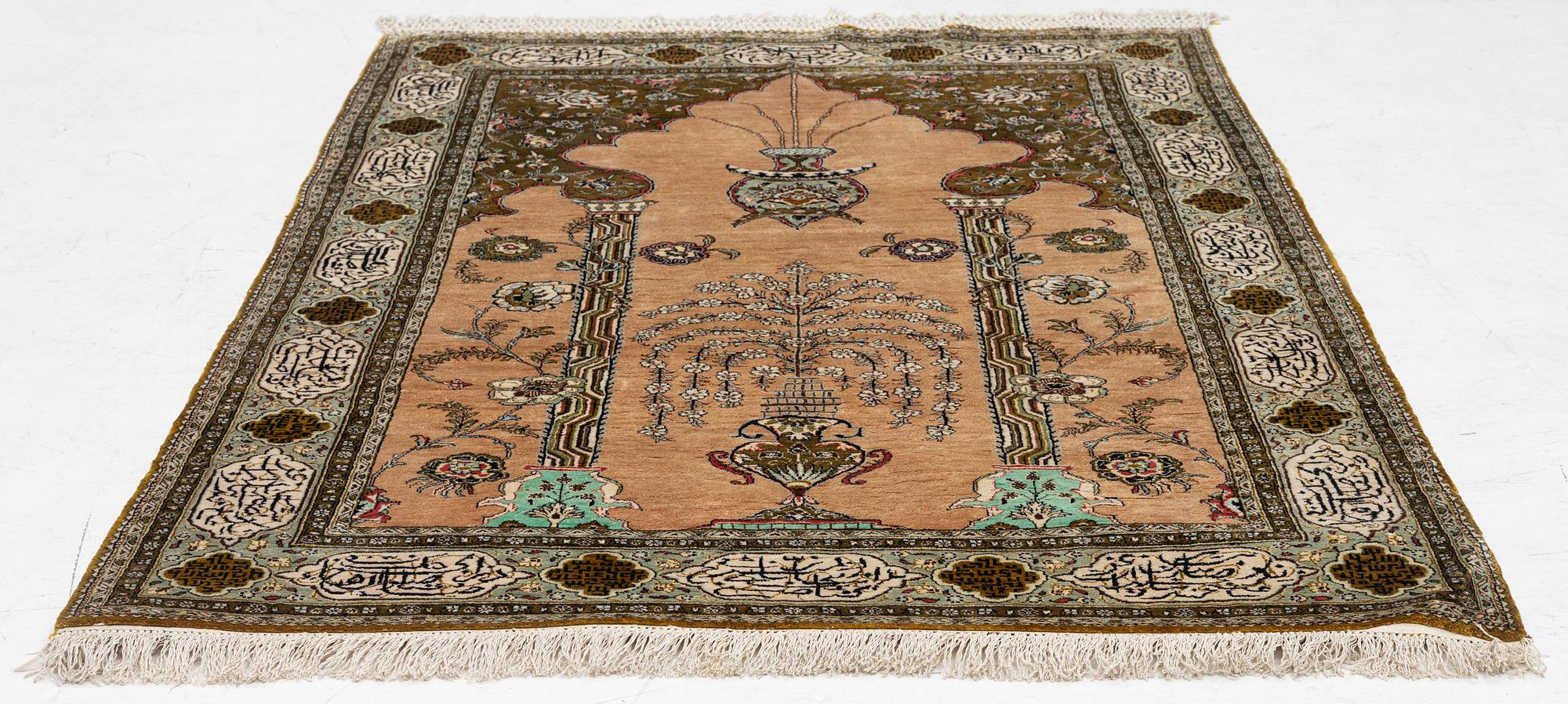 A silk Quum rug, c. 155 x 103 cm.