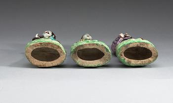 A set of three famille rose figures of immortals, Qing dynasty, ca 1800.