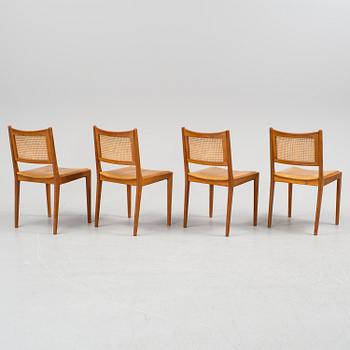 Four teak and rattan chairs, dated 62.