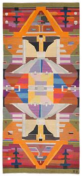 663. CARPET. Flat weave and tapestry weave (Rölakan and gobelängteknik). 603 x 270 cm. Signed AÖ woven as well as AGDA ÖSTERBERG 1964 embroidered at the back.