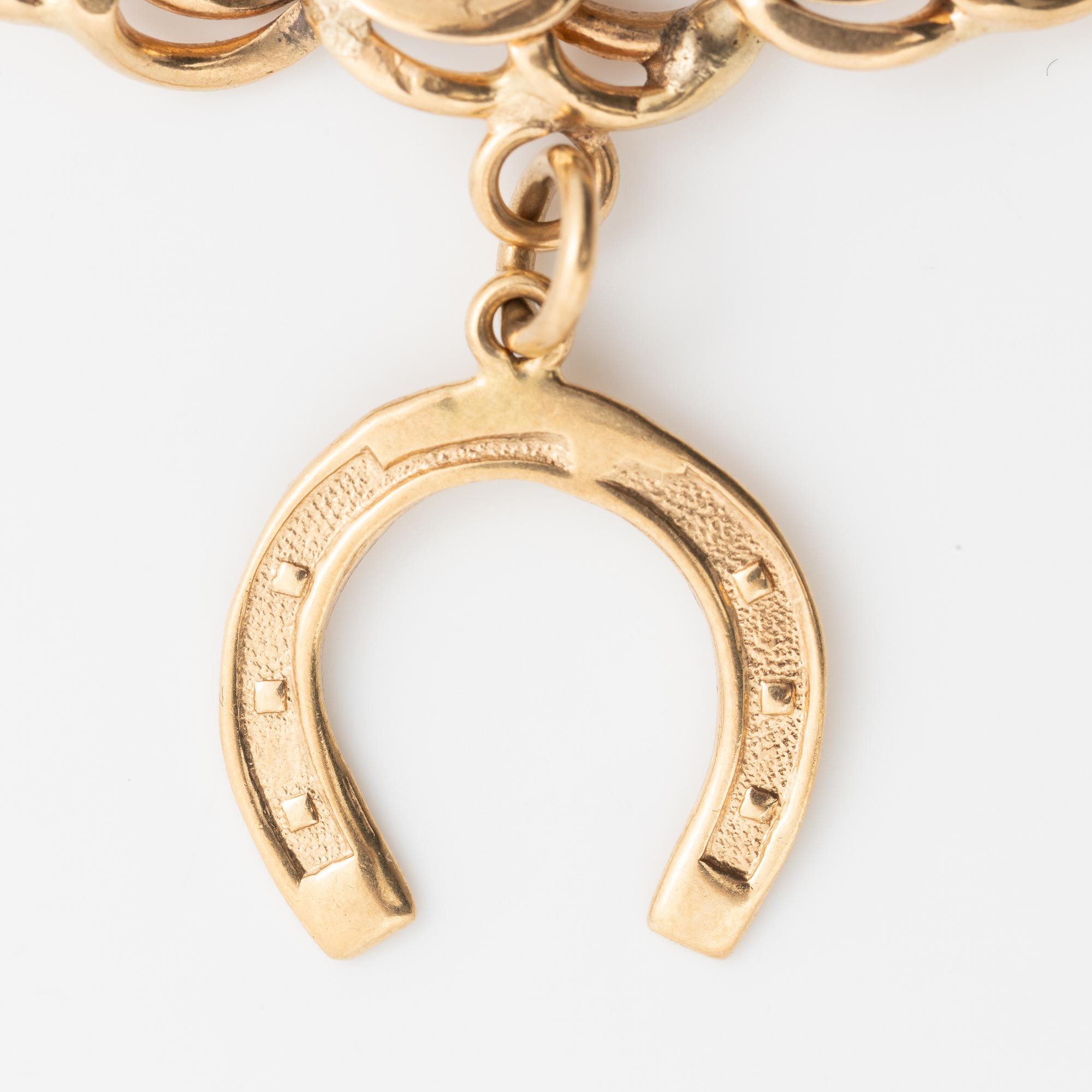 Armband 18K guld bismarcklänk, med berlocker.