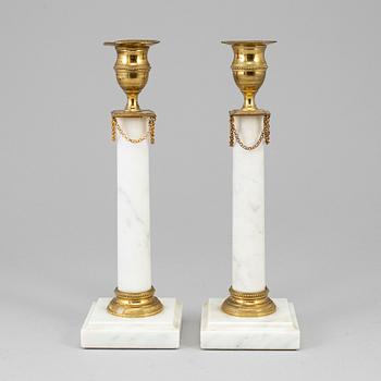 A pair of gustavian style candlesticks, early 20th century.