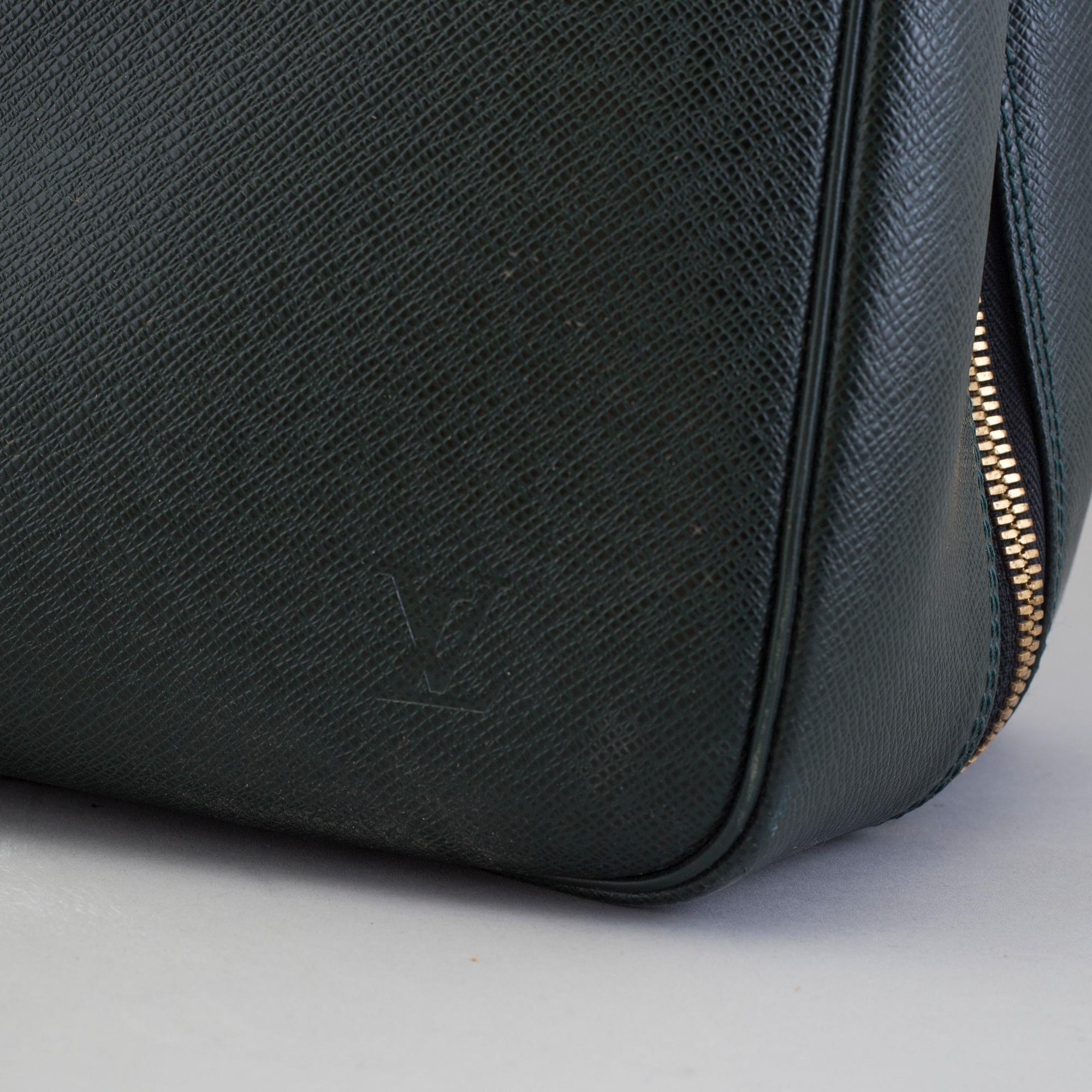 LOUIS VUITTON, a taiga leather 'Helanga' weekend bag.
