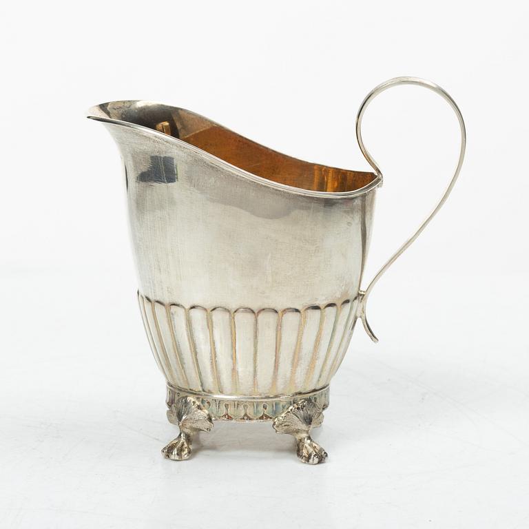 A Swedish silver coffee pot, cream jug and sugar box, Gustavian style, mark of AG Dufva, Stockholm 1911-1912.