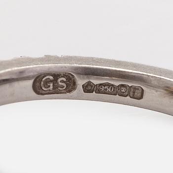 platinum ring with yellow radiant-cut diamond and brilliant cut diamonds.