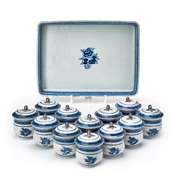 A set with a blue and white tray and 12 custard cups with stands, Qing dynasty, Qianlong (1736-95).