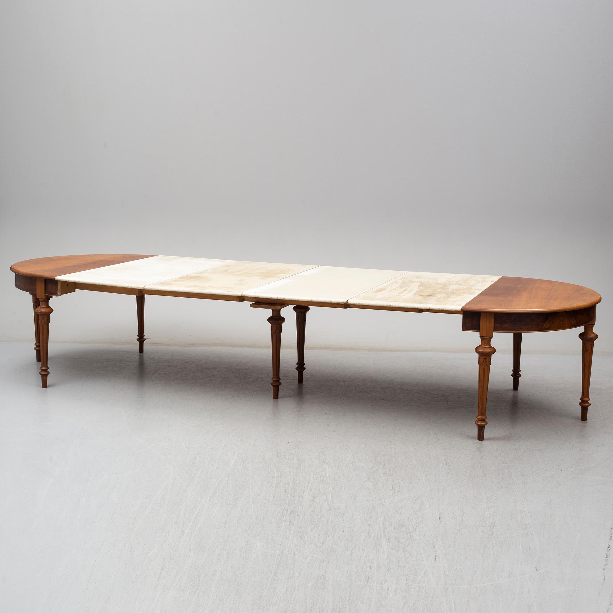 A DINING TABLE, second half of the 19th century. 5 painted leaves included.