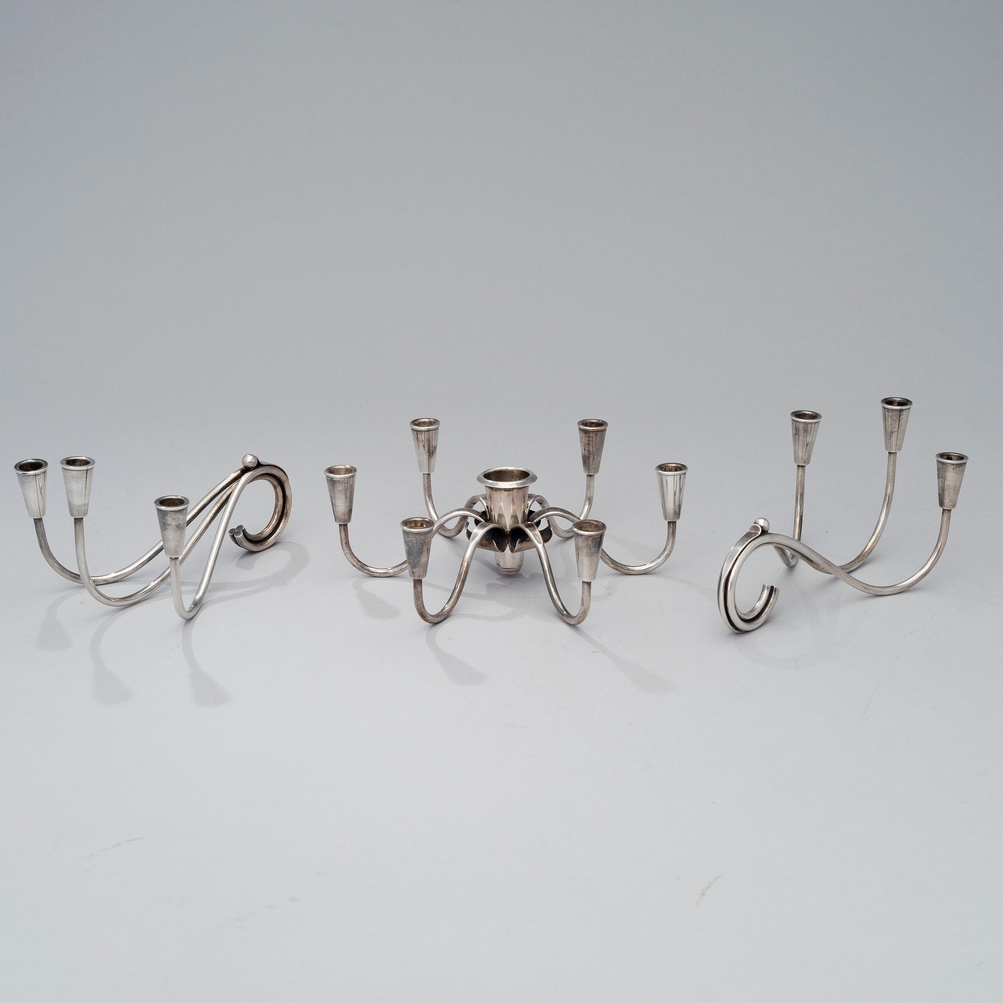 A pair of silver plated candelabra and a candelabrum, FDG, Denmark, mid 20th century.