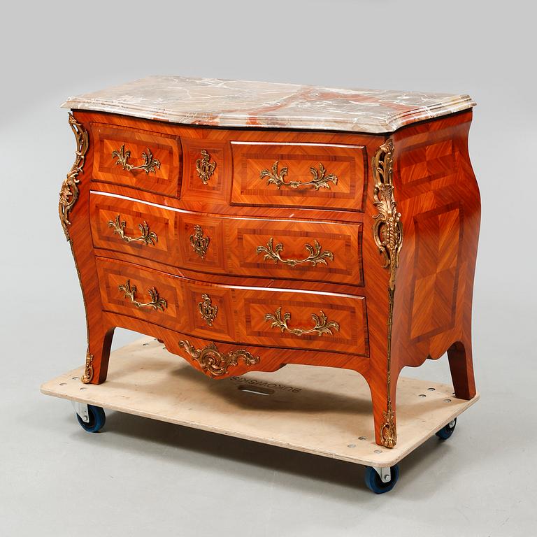 A rococo style chest of drawers, around the mid 20th century.