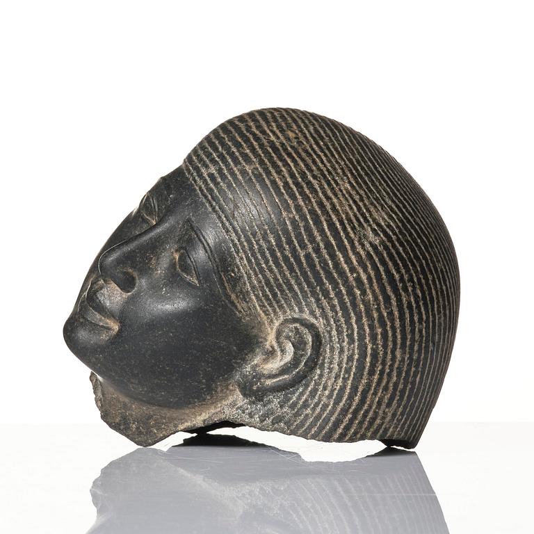 An Egyptian basalt head of a man, Grand tour, 19th century.