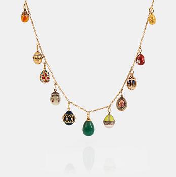 919. A FABERGÉ  GOLD Chain Necklace WITH 8 GOLD, ENAMEL ETC MINIATURE EASTER EGG PENDANTS, S.T PETERSBURG and 3 other.