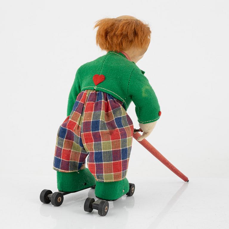 A set of five toys, including 'Rolly' clown from Schuco, 20th century.