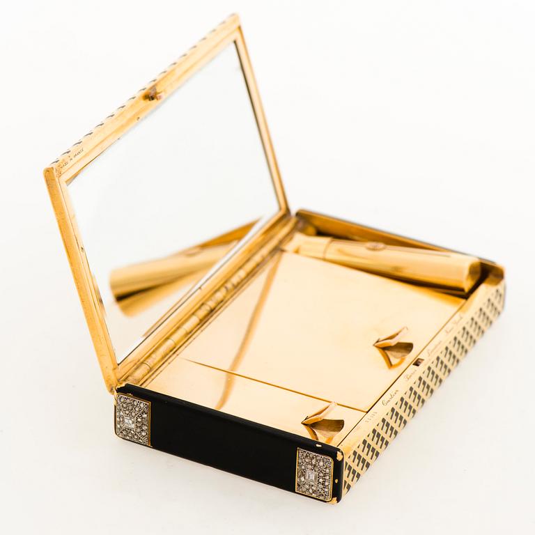 Cartier Art Deco Vanity Case 18K guld med svart emalj och baguette- och rosenslipade diamanter.