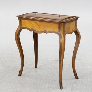 A Louis XV style table, circa 1900.