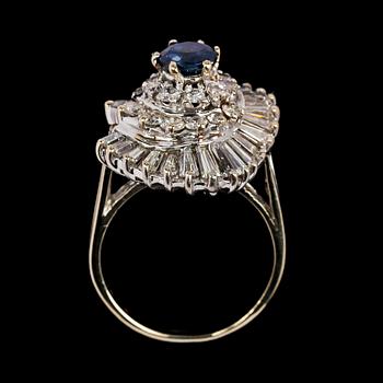 RING, blue sapphire, app 1 cts, brilliant cut and baguette cut diamonds, tot. app. 2 cts.