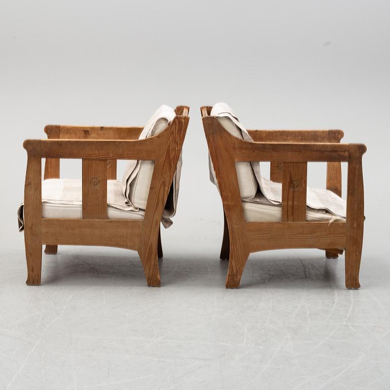 A pair of pine armchairs attributed to Carl Westman, early 20th Century.