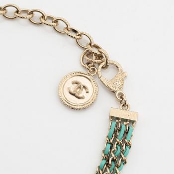 Chanel, a silver tone pearl and leather necklace.