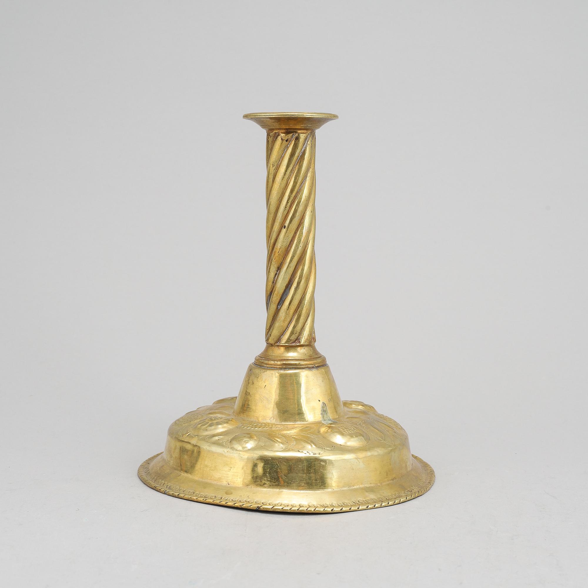 A 19th Century baroque style candlestick, with older parts.