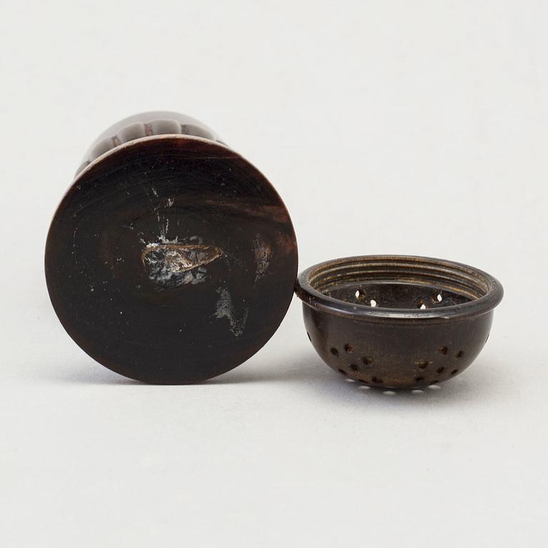 A 18th Century horn saltshaker.