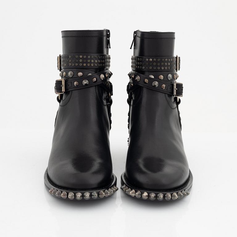 Yves Saint Laurent, a pair of black leather and studs boots, size 38.