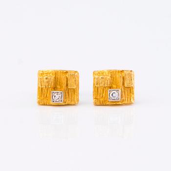 A pair of 14K 'Diamond city' by Björn Weckström for Lapponia, Finland.