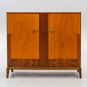 A Swedish Modern cabinet, mid20th century.