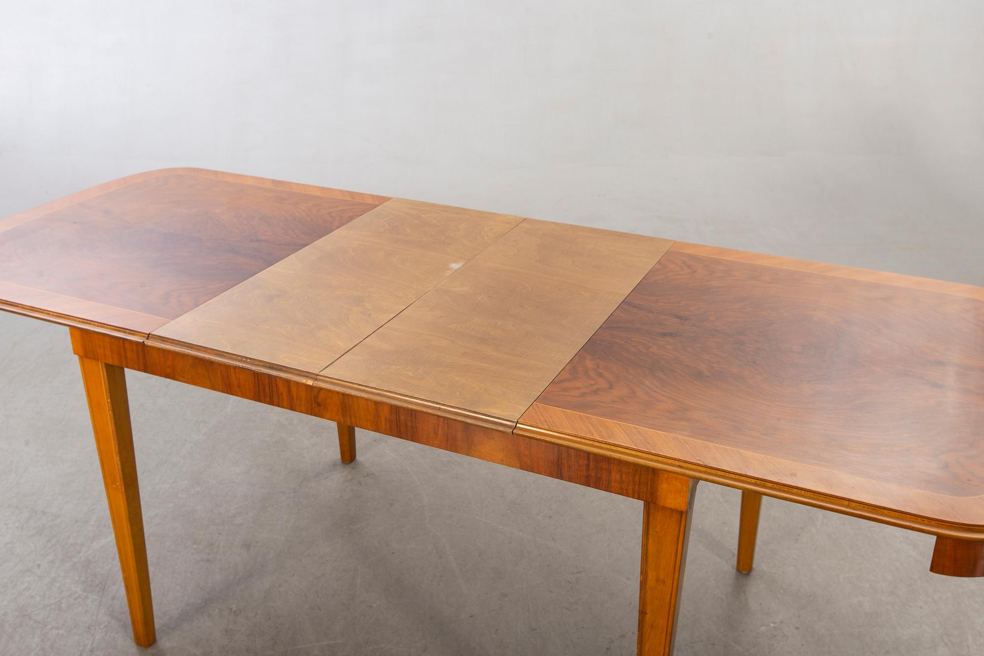 A 1950/60's dining table and chairs.
