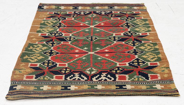 A carrige cushion, "Rosettes", flat weave, c. 88 x 58 cm, Skytts or Oxie district, southwestern Scania,.