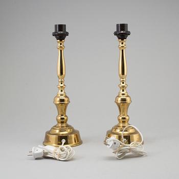 A pair of mid 29th century brass table lamps.