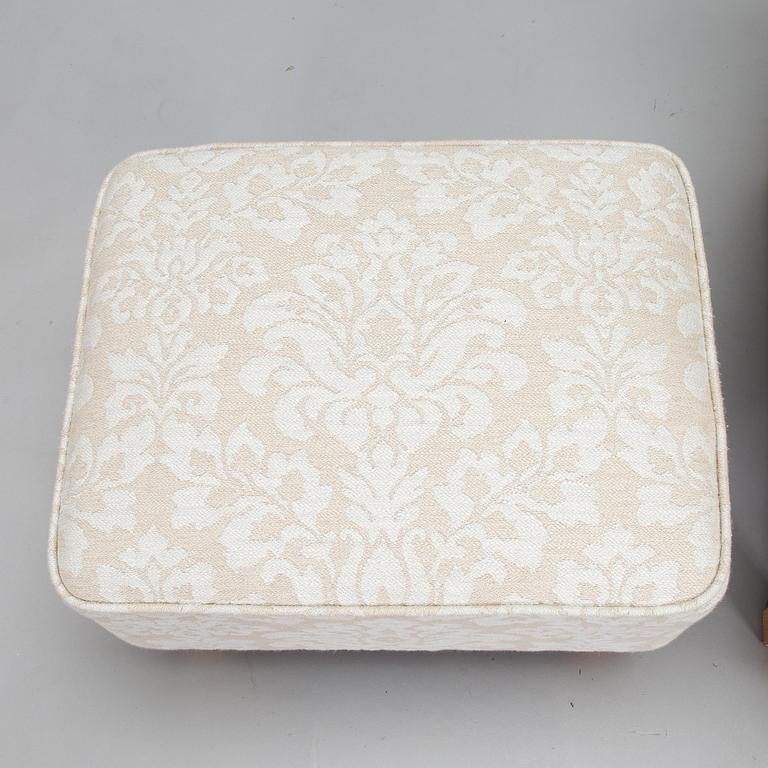 A mid-20th-century armchair and ottoman.